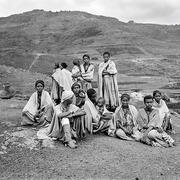 Group of Ethiopians sit in the desert